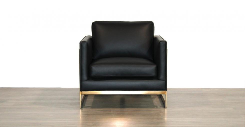black leather chair with brass frame
