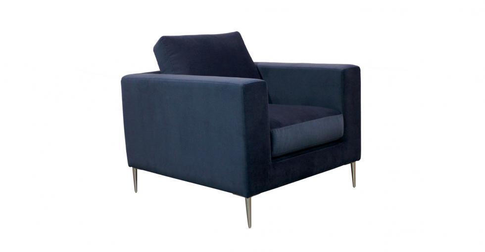 chair upholstered in blue velvet fabric